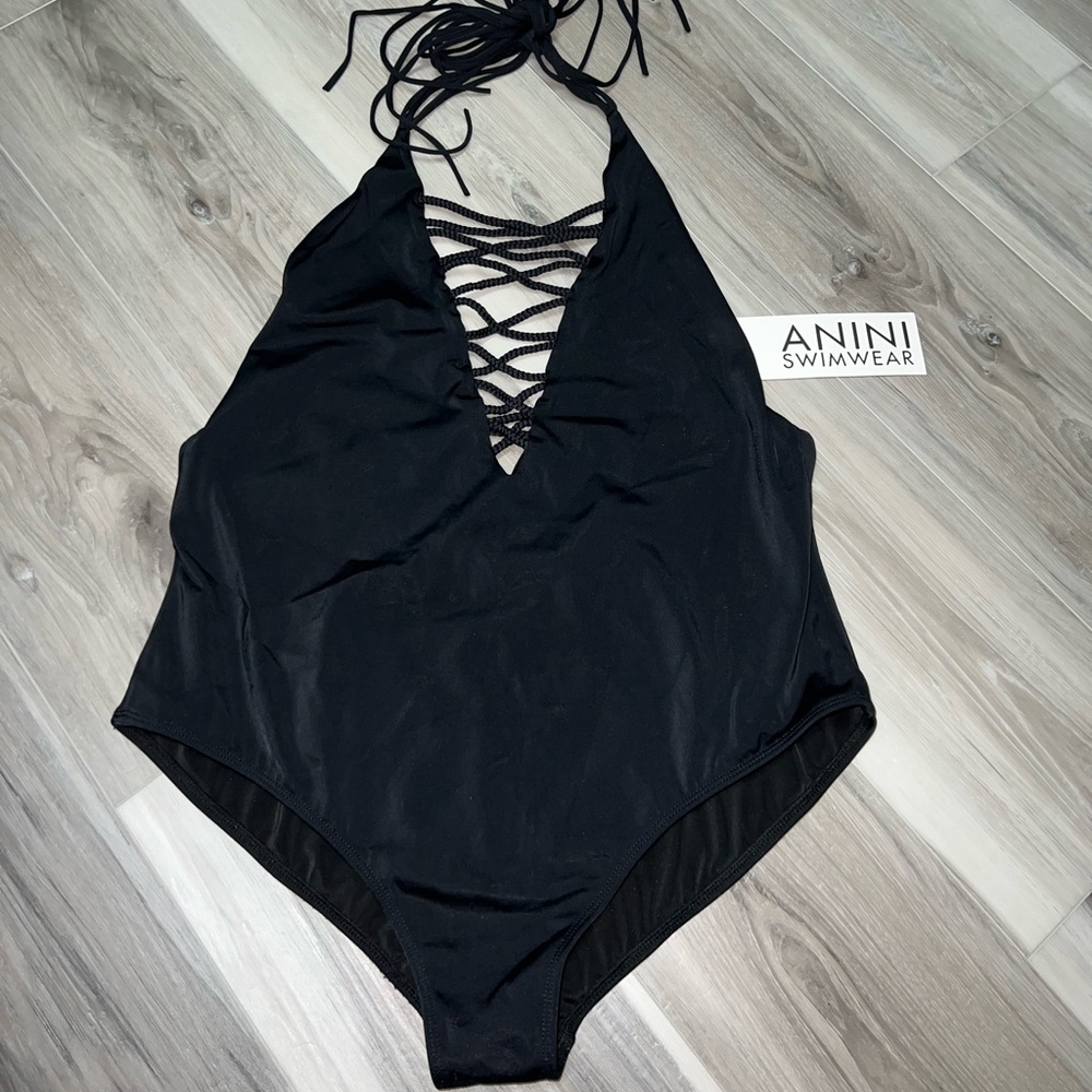 Black one piece w/tie neck